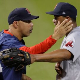 Boston Red Sox manager Alex Cora and Rafael Devers